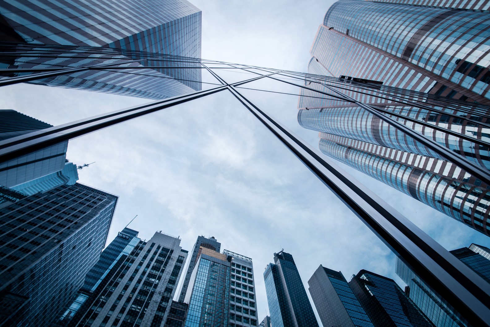 Low-angle view of glass financial district office towers